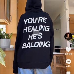 VIRAL “YOU’RE HEALING, HE’S BALDING” HOODIE